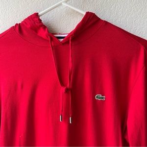Red Lacoste pullover hoodie.